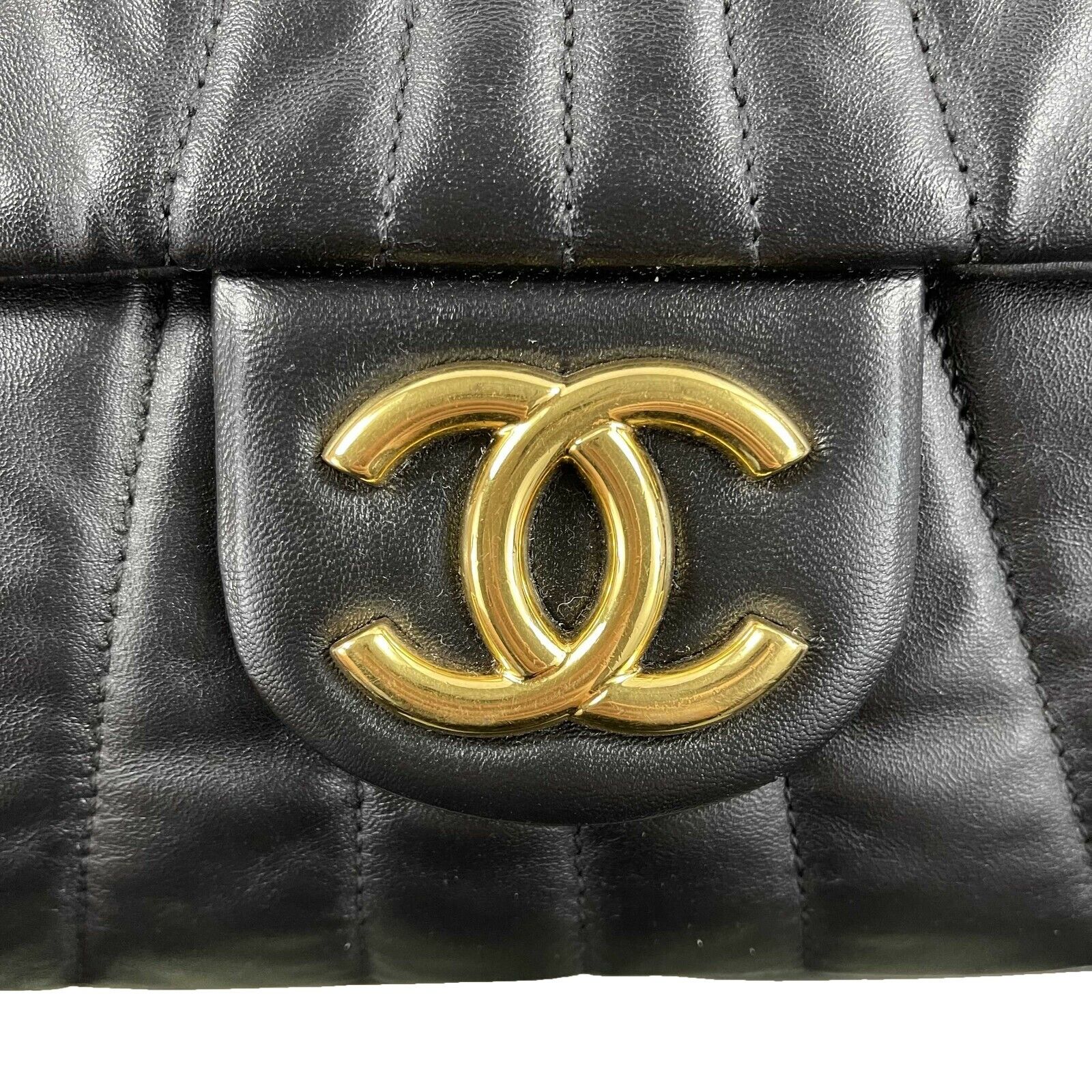CHANEL - Wave Quilted Black Calfskin Leather Maxi Flap - Gold-tone